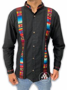 Mexican Artisan Shirt type Guayabera long sleeve. Typical Mexican design. Made by our artisans Chiapanecas by hand on blanket fabric. Handmade design work that, although they follow the same pattern, the colors of the embroidered geometric strips-stripes can vary from piece to piece. Material: blanket (cotton). Sizes: CH, M, G and EG. Primary colors: dark or light. Multicolor embroidery by hand. The availability of colors and sizes is limited, images are just examples to illustrate how it is sha Traditional Long Sleeve Shirt, Traditional Long Sleeve Shirt With Patterns, Traditional Black Long Sleeve Shirt, Traditional Long Sleeve Black Shirt, Bohemian Black Long Sleeve Shirt, Traditional Fitted Long Sleeve Shirt, Traditional Long Sleeve Cotton Shirt, Traditional Multicolor Fitted Shirt, Traditional Fitted Multicolor Shirt