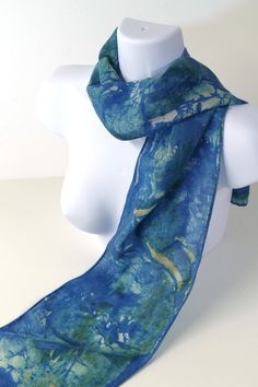 This particular scarf features a medley of blues with traces of off-white and tan brown - it was hand-dyed using non-toxic dyes, and the hem is hand-finished.  Constructed from a silk/wool 65%/35% blend, it is lightweight and semi-sheer with a diagonal weave. Blends such as this are warmer for winter than 100% silk, while the looser weave is softer with a slight raspy feel, closer to a heavyweight chiffon. It makes a great fabric base for hand-painted and dyed techniques. The hand-dyed/painted d Artistic Hand Dyed Blue Silk Scarf, Blue Bohemian Hand-dyed Silk Scarf, Blue Bohemian Hand Dyed Silk Scarf, Blue Hand-dyed Silk Scarf For Summer, Blue Hand Dyed Silk Scarf For Summer, Hand Dyed Blue Silk Scarf For Summer, Summer Hand Dyed Blue Silk Scarf, Artistic Handmade Blue Silk Scarf, Blue Hand Painted Bohemian Silk Scarf