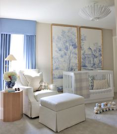 a baby's room is decorated in blue and white