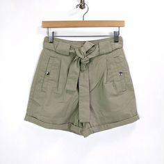 Please Check The Measurements Below To Make Sure It's A Perfect Fit For You Miss Selfridge Womens Waist Tie Paperbag Denim Shorts - New With Tags - Size 4 - Color: Khaki Green, Sage Green, Grayish Green - 65% Cotton, 35% Recycled Polyester - Tie Waist - Rolled Hem - Front Pockets With Snap Button Closure - Faux Back Pocket - Waist 13 1/4" - Hips 18 3/4" - Length 14 3/4" - Rise 12.5" - Inseam 3 1/4" Utility Style Jean Shorts With Belt Loops, Summer Utility Jean Shorts With Belt Loops, Utility Jean Shorts For Spring, Utility Jean Shorts With Belt Loops, Utility Jean Shorts With Belt Loops For Summer, Spring High Rise Utility Jean Shorts, Utility High Waist Shorts With Belt Loops, Utility Denim Shorts For Summer, High Waist Utility Shorts With Belt Loops