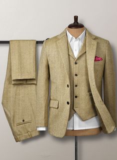 Aim for a lavish take on a casual style with our Highlander Heavy Beige Herringbone Tweed Suit. Most significantly, crafted from a pure wool material expresses a thick, decently rugged and gorgeously soft texture with a distinctive herringbone weave over a brown hue. Additionally, the cloth exudes an enormously cozy vi Winter Semi-formal Tweed Three-piece Suit, Semi-formal Winter Tweed Three-piece Suit, Beige Tweed Blazer For Business, Fitted Tweed Blazer With Herringbone Pattern, Tweed Three-piece Business Suit For Fall, Winter Tweed Three-piece Suit, Business Tweed Three-piece Suit For Fall, Fall Business Tweed Three-piece Suit, Elegant Fitted Tweed Three-piece Suit