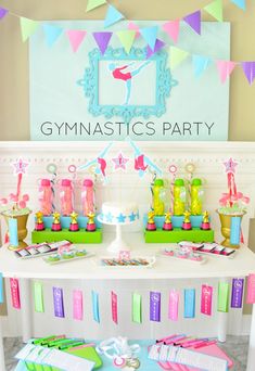 a birthday party with colorful decorations on the table