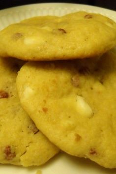 three cookies sitting on top of a white plate