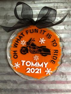 a round ornament that says, what fun it is to ride tommy 2091