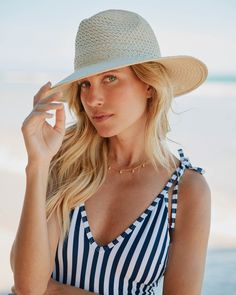 Our vented woven fedora boasts both classic and elevated style, with SPF protection and an adjustable sweatband for a customized fit. Plus, it's designed to be packable, making it the perfect accessory for your next getaway or everyday wear. Enjoy the quality craftsmanship of 100% Paper Straw. The hat measures 4" in Crown Height and 3.5" in the brim. Style: 11039 Travel Boater Hat With Upf 50+ And Short Brim, Upf 50+ Fedora Panama Hat For Travel, Travel Fedora With Upf 50+ And Flat Brim, Beachy Panama Hat For Travel, Beachy Panama Sun Hat For Travel, Beachy Sun Panama Hat For Travel, White Panama Hat For Travel And Beach Season, White Panama Hat For Beach Season Travel, White Panama Hat For Beach Travel