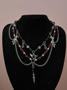 Gothic handmade beaded necklace giving off vampire vibes. Made of stainless steel and glass and acrylic beads. Gothic Bead Necklace, Gothic Vampire Jewelry, Glass Bead Necklace Diy, Vampire Jewelry Diy, Handmade Gothic Jewelry, Halloween Beaded Necklace, Vampire Jewelry Aesthetic, Halloween Accessories Jewelry, Goth Necklaces