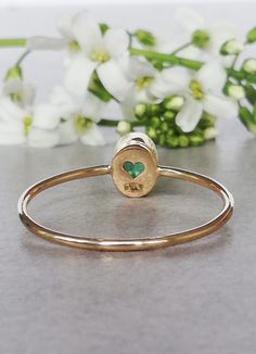 Beautiful, classic, delicate oval Emerald Ring in 14k Yellow Gold, Emerald Engagement Ring. CENTRAL STONE: *natural, Earth mined emerald *shape: oval *The emerald is bezel set and the mounting around the stone is hammered *Emerald with setting measures approximately: 5.8mm X 4.9mm SPECIFICATIONS: *band: approximately 1 mm * material: 14k yellow gold, Eco friendly, recycled (this ring is also available in 14k rose or white gold, for 18k please inquire about the price) * size: this ring is availab Green Gemstone Heart Ring For May Birthstone, Green Heart Ring For May Birthstone Gift, Heart-shaped Ring For May Birthstone Gift, Heart-shaped May Birthstone Ring For Gift, 14k Stamped Emerald Ring As Gift, Emerald Ring Stamped 14k As Gift, Gift Emerald Ring With 14k Stamp And Round Band, Oval Gemstone Heart Ring As Gift, Heart-shaped Emerald Ring For May Birthstone