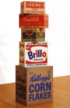 three boxes stacked on top of each other with different types of corn flakes in them