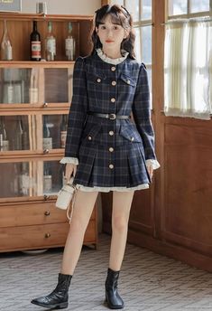 This preppy mini dress features a modest high neckline, button-down closure, faux pockets at the chest and hips, and frilly cuffs. Its shoulders are slightly puffed for an exquisite sense, and the skirt is pleated at the hem with a longer lining to produce an underskirt effect. A belt is included to cinch the waist. S: 32" chest, 25" waist, 30" lengthM: 33.5" chest, 26.5" waist, 30.5" lengthL: 35" chest, 28" waist, 31" lengthXL: 36.5" chest, 29.5" waist, 31.5" length