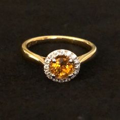 14k Gold Ring Features Round Orange Citrine And Diamond Halo. Comes With Black Velvet Ring Holder. Fine Jewelry Orange Sapphire Anniversary Ring, Fine Jewelry Yellow Gold Round Cut Gemstones, Formal Citrine Rings With Brilliant Cut, Luxury Orange Jewelry With Yellow Sapphire, Orange Sapphire Ring For Anniversary, Orange Sapphire Ring For Formal Occasions, Orange Sapphire Round Ring, Orange Round Yellow Sapphire Jewelry, Luxury Orange Yellow Sapphire Jewelry