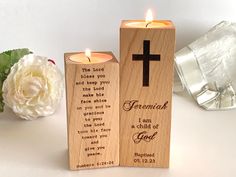 two wooden candles with the words and cross on them