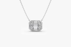 "Diamond Necklace / 14k F Color VVS Clarity 1.25Ctw Look Emerald Cut Illusion Setting Diamond Necklace / Step Cut Mosaic Diamond Pendant by Ferkos Fine jewelry This pendant has the face-up look of a 1.25ct emerald cut diamond, for a fraction of the cost! The total weight on this Pendant is 0.48ctw. Accurately custom cut, 9 step-cut baguette diamonds are matched and cut perfectly so they sit next to each other flawlessly, giving the appearance of a single diamond. The Pendant is made in White Gol Luxury 14k White Gold Jewelry With Baguette Diamonds, 14k White Gold Jewelry With Diamond White Baguette Diamonds, Dazzling White Baguette Diamond Necklace, White Diamond Necklace With Baguette Cut Accents, White Baguette Cut Diamond Necklace With Accents, 14k White Gold Jewelry With Baguette Cut, Platinum Baguette Diamond Necklaces Gift, Platinum Necklaces With Baguette Diamonds For Gift, White Baguette Cut Lab Grown Diamond Jewelry