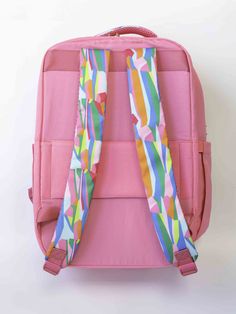 The Travel Backpack is a blend of style and practicality designed to enhance your travel experience. It features a solid color exterior adorned with vibrant patterns on the handles and straps. Its size is the perfect balance between spaciousness and convenience, making it an ideal companion for your travels! Details: 13"W x 16.5"H x 8"D Patterned handle and straps Two main large pockets Two side pockets One front pocket Luggage sleeve with zipper pocket Polyester material Gold hardware Pink Backpack, Travel Backpack, Gold Hardware, Travel Experience, Zipper Pocket, Zipper, Solid Color, Backpacks, Pink