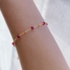 "* DETAILS* This dainty bracelet is a perfect gift to the one you love or to yourself. A nice every day bracelet. - AAA+ Natural Ruby Beads - 24k Gold Filled Chain - 14K GOLD FILLED Wire - 14k Gold Filled Spring Ring Clasp - 14k Gold Filled Link Rings - Bracelet has a 1\" Extension with gold filled ball charm. ✨All components are gold filled. 👉🏻For more birthstone bracelets, see https://www.etsy.com/shop/JinnysJewelryBySeJin You may also like 🌟Sapphire Bracelet. https://www.etsy.com/JinnysJew Delicate Bracelets With Tiny Beads, Dainty Bracelets For Birthday Gift, Dainty Gemstone 14k Gold Filled Bracelets, Dainty Hypoallergenic Beaded Bracelets As Gift, Dainty Hypoallergenic Bracelets As Birthday Gift, Dainty Hypoallergenic Beaded Bracelets For Gifts, Dainty Hypoallergenic Bracelets For Birthday Gift, Dainty Hypoallergenic Bracelet For Birthday Gift, Dainty Hypoallergenic Bracelet For Birthday