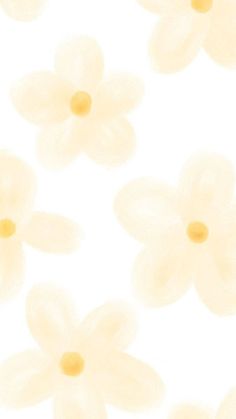 some white flowers are floating in the air on a white background with yellow centers and petals