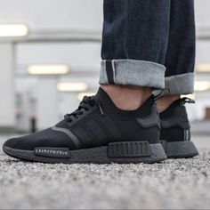 The Adidas Nmd R1 Is Back In All-Black. Nicknamed The "Triple Black" Edition, This Pair Is A Part Of The "Japan Boost" Pack. Sporting A Primeknit Upper, Boost Cushioning And A Black Sole With "The Brand With The Three Stripes" Written In Japanese On The Eva Insert Overlay On The Midsole As Well As On The Back Heel Pull Tab. Their Release Date Was August 11th, 2017 Where They Retailed For $170 In Men's Sizing. Another Perfect Adidas Nmd R1 For Everyday Wear. You Can Never Go Wrong With A Fresh All-Black Nmd In Your Rotation. Worn Once Black Nmd, Adidas Nmd R1, Nmd R1, Adidas Nmd, Triple Black, Black Edition, Pull Tab, Black Adidas, Mens Shoes Sneakers