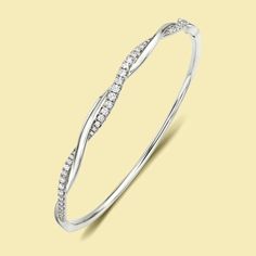 The Claire, Braided Twist Diamond Bangle is handcrafted in 14K gold, 18K gold, or Platinum. Enhance your wardrobe with the everlasting elegance of The Claire, Braided Twist Diamond Bangle. A necessity for those who appreciate exquisite jewelry, this breathtaking bangle can be worn solo or paired with other pieces for a flawlessly refined appearance. Make a statement and showcase your individual style with this luxurious accessory. ***Listing photos displayed in 48x58mm (inside diameter)*** // Details //• Style Name: Claire• Item Type: Bangle• Setting Type: Pave• Metal: 14K gold, 18K gold, or Platinum• Stone: Lab-grown or Earth-mined Diamond• Shape: Round• Cut: Brilliant-cut• Handmade to order // Custom Order //Want something that is truly unique and custom-made to fit your style? Any detai 14k Gold Jewelry With Brilliant Cut In Modern Twist, Modern Twist 14k Gold Brilliant Cut Jewelry, Elegant Flexible White Gold Bracelet, Elegant 14k Gold Diamond-cut Bangle, Elegant 14k Gold Diamond Cut Bangle, Elegant 14k Gold Bangle With Diamond Cut, Elegant 14k Gold Flexible Bangle, Round Jubilee Bangle Fine Jewelry, Elegant Flexible Diamond Bangle Bracelet