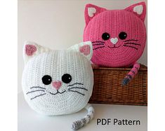 two crocheted cats sitting next to each other