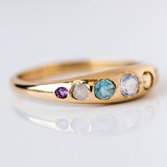 Yowza... The She's an Artist Ring is a serious showstopper. Pink opal, peach moonstone, citrine, opal, aquamarine, chalcedony, amethyst on front with a teeny tiny rainbow moonstone on the back! Love is an understatement, we're obsessed! Pink opal 1.5mm Peach moonstone 2mm Citrine 2.5mm Opal 3mm Aquamarine 2.5mm Chalced Five Golden Rings, Golden Rings, Local Eclectic, Golden Ring, Spring Fits, Peach Moonstone, Lovely Ring, Pink Opal, It's Hard