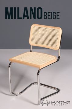 the chair is made out of metal and has a woven seat pad on one side