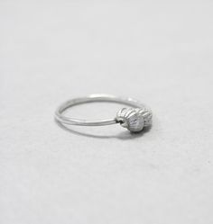 I live near the beach so seashells and pebbles always have a place in my shop. These seashells are exact copies of the real ones made in sterling silver with the lost wax casting technique. The seashell is approximately 10mm x 5 mm. This is a dainty ring that can be stacked along with others. You can choose to have it in plain silver or oxidised and brushed. Each ring is handmade to order and may slightly vary from the pictures. Please allow for subtle variations making each handmade piece uniqu Silver Shell Rings For Gift, Ocean-inspired Sterling Silver Jewelry For Wedding, Ocean-inspired Sterling Silver Jewelry For Weddings, Unique Silver Shell Rings, Ocean-inspired Silver Jewelry For Wedding, Handmade Silver Rings With Ocean-inspired Style, Silver Ocean-inspired Jewelry For Promise Ring, Silver Ocean-inspired Promise Ring, Ocean-inspired Sterling Silver Rings