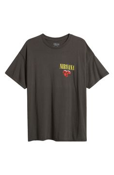 a black t - shirt with the words nirvana printed in yellow and red on it