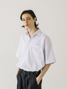 Editor's NotesThis refined shirt is tailored from the classic pin-striped pattern with a cool touch and designed in an oversized fit with a high-low hem. It goes well with various bottoms so it will be your versatile daily item.- Collared neck- Button fastenings- One chest pocket- Short sleeves- Hi-low hem- Oversized fitMeasurements (in.) M / L - Total Length (Front): 29.1 in. / 30.3 in. - Total Length (Back): 31.1 in. / 32.3 in.- Shoulder: 23.6 in. / 25.2 in. - Chest: 26.4 in. / 28.0 in. - Sleeve Length: 9.4 in. / 9.8 in.Model info: 5' 11.3, 130.1 lbs / Fitting size MComposition & Care- 100% Polyester- Dry clean- Water wash (do not dry clean)Designer- by VASTIC Striped Relaxed Fit Shirt For Business Casual, Business Casual Striped Top With Relaxed Fit, Striped Tops For Business Casual With Relaxed Fit, Striped Relaxed Fit Top For Business Casual, Pinstripe Shirt For Business Casual, Casual Pinstripe Shirt For Business Casual, Casual Pinstripe Tops For Business Casual, Classic Pinstripe Tops With Relaxed Fit, Spring Business Shirt With Vertical Stripes