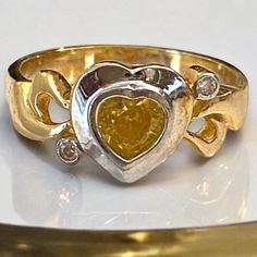 GORGEOUS Custom Estate 14K Gold Bezel Heart Citrine and Diamond Ring Size 6.75 Expertly crafted of solid 14k (585) yellow gold, with white gold around bezel set heart citrine! Gorgeous scroll design with two (2) Sparkling bezel set diamonds! You will LOVE IT!! * Size 6.75 * Beautiful heart cut citrine measuring approximately 5mm, with two (2) -.03ct round cut bezel set diamond accents! * Weighs 3.9 grams Will ship FAST AND FREE, fully insured in a gift box :) Gold Heart Cut Ring With Bezel Setting, Gold Heart Rings With Bezel Setting, Gold Heart Ring With Bezel Setting - Fine Jewelry, Yellow Rings With Polished Finish For Anniversary, Anniversary Yellow Rings With Polished Finish, Heart Cut Yellow Jewelry For Anniversary, Yellow Heart Cut Jewelry For Anniversary, Yellow Bezel Setting Jewelry For Anniversary, Yellow 14k Stamped Jewelry For Anniversary