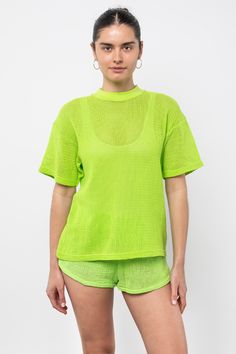 Easy, breezy and lightweight feel! This classic fit Mock Neck T-shirt in a cotton fishnet fabric is ideal for summer days! Wear it over your swimsuit from our line, pair it with our matching RIN304GD cotton fishnet shorts for the full look or for a daily look with jeans. Oversized and one-sized to accommodate a range of sizes. Constructed from 100% breathable cotton fishnet fabric. | Shirt For Women In Blue Violet Fishnet Shorts, Summer Purple Relaxed Fit T-shirt, Casual Neon Cotton T-shirt, Purple Short Sleeve T-shirt For Beach, Urban Purple Short Sleeve T-shirt, Mock Neck And T Shirt, Playful Purple Cotton T-shirt, Full Look, Blue Violet