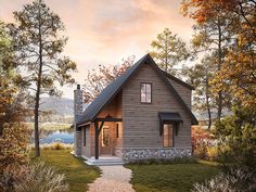 a small cabin style house in the woods with a pathway leading to it's front door