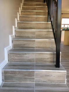 the stairs are lined with gray tile