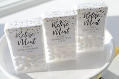 three packages of refrigerated mints sitting on a white plate with gold confetti