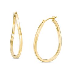 She'll absolutely adore these dazzling hoop earrings. Crafted in warm 10K gold, each oval-shaped hoop features soothing wavy lines that catch and reflect light. Buffed to a brilliant luster, these earrings secure with latch backs. Formal Hypoallergenic Oval Hoop Earrings, Classic Teardrop Hoop Earrings With Lever Back, Oval Huggie Earrings For Formal Occasions, Elegant Oval Hoop Earrings With Ear Wire, Anniversary Oval Hoop Earrings With Ear Wire, Elegant Oval Hypoallergenic Hoop Earrings, Elegant Hypoallergenic Oval Hoop Earrings, Oval Hoop Earrings With Shiny Finish For Anniversary, Anniversary Hypoallergenic Oval Hoop Earrings