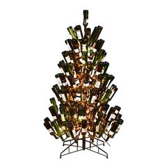 a tree made out of wine bottles with lights on it's top and bottom