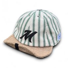 This Makshy baseball cap goes beyond the ordinary with its bold green stripes and timeless design. Crafted from premium cotton herringbone fabric, it offers a distinct textured pattern that instantly elevates your everyday look. The sleek, form-fitting design ensures a modern silhouette that flatters any head shape, making it a versatile piece that transitions seamlessly from casual outings to city adventures. As a milliner, I want you to feel confident and comfortable. Beyond style, this baseba Green Flat Cap For Summer, Green Summer Flat Cap, Striped Cotton Casual Hat, Outdoor Six-panel Fitted Hat For Baseball Season, Casual Striped Cap, Green Curved Brim Baseball Cap For The Beach, Curved Brim Snapback Hat For Beach And Baseball Season, Green Curved Brim Baseball Cap For Beach, Green Baseball Cap For Streetwear