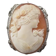 Vintage 14 Karat White Gold Cameo Brooch/Pendant- This stunning cameo features a lovely lady in profile set in beautifully detailed 14K white gold filigree. Can be worn as a brooch or a pendant. Size: 48.4 mm x 39.2 mm Stamped: 14K Weight: 14.0 gr./ 9.0 dwt. Very good condition, professionally polished. Will come packaged in a gift box or pouch (when possible) and will be shipped U.S. Priority Mail Insured. DV101623/17KCS Classic Cameo Brooches For Wedding, Elegant Formal Brooch With Intaglio Detail, Elegant Cameo Brooch For Formal Wear, Elegant Intaglio Brooch For Formal Occasions, Elegant Intaglio Brooches For Gifts, Elegant Formal Cameo Brooch, Elegant Medallion Brooch For Collectors, Luxury Cameo Brooch For Wedding, Luxury Cameo Brooches