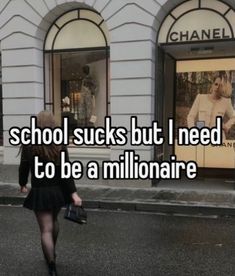 a woman walking down the street in front of a store with text that reads school sucks but i need to be a millionaire