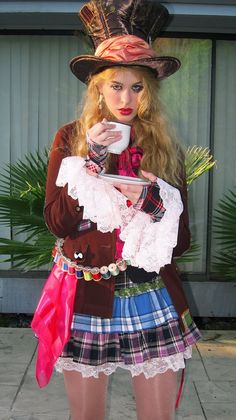 a woman in a costume holding a coffee cup