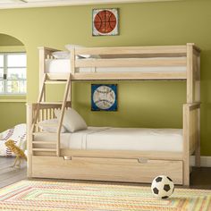 a bedroom with a bunk bed and a soccer ball on the floor