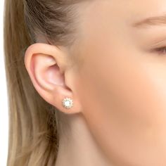 Say hello to your latest accessory obsession! These stunning Opal and Flower Stud Earrings Gold are every modern girl's dream. Crafted from 925 sterling silver dipped in 18ct gold, these dainty earrings feature a pretty opal set within a dainty flower setting that is sure to make you stand out in the crowd.  And if that isn't enough, these earrings are adorned with sparkling cubic zirconia that guarantee you will be looking good no matter the occasion. Whether you need an extra something special Flower Setting, Stud Earrings Gold, Flower Stud Earrings, Flower Stud, Flower Earrings Studs, Looking Good, Flower Studs, Dainty Earrings, White Opal