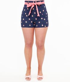 These retro shorts are crafted in a marvelous stretch fabric cast in navy and pink strawberry stamps, cinched with a front zipper and hook bars while the high waist is embellished with a pink sash and outfitted with side pockets.Available in sizes XS-5X while supplies last. Fitted Tie-side Shorts For Summer, Cute Fitted Shorts With Elastic Waistband, Spring Cotton Bottoms With Strawberry Print, Fitted Tie Waist Bottoms For Summer, Pink Fitted Bottoms With Strawberry Print, Fitted Pink Bottoms With Strawberry Print, Pink Tie Waist Vacation Bottoms, Pink Tie Waist Bottoms For Vacation, Cute Strawberry Print Bottoms For Spring