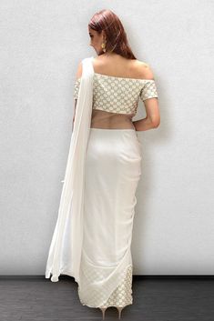 White Georgette Pre-draped Saree With Pearl Embroidery, Festive White Pre-draped Saree With Pearl Embroidery, White Pearl Embroidery Saree, Elegant White Embroidered Blouse Piece, White Embroidered Pre-draped Saree For Party, White Embroidered Blouse For Party, Festive White Blouse With Pearl Embroidery, White Embellished Choli With Traditional Drape, Festive White Blouse Piece With Pearl Embroidery