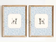 two framed pictures hanging on the wall next to each other with dogs drawn on them