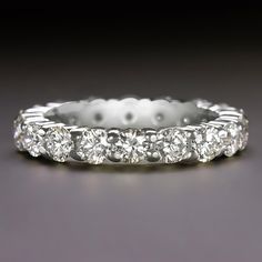 a white gold wedding band with five diamonds