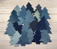 several pieces of denim are arranged in the shape of trees