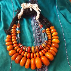 Three old Berber Necklace stone & Bead resin amber color, Ethnic Jewelry Morocco | eBay Artisan Orange Beaded Necklaces For Festivals, Vintage Amber Jewelry With Large Beads, Unique Orange Necklace With Polished Beads, Handmade Bohemian Amber Beads, Orange Wooden Beads For Jewelry Making, Bohemian Amber Beads With Natural Stones, Bohemian Amber Natural Stone Beads, Orange Beaded Amulet Jewelry, Unique Orange Jewelry With Wooden Beads