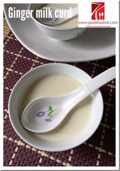 there is a spoon in a bowl next to another bowl on the table with food