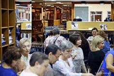 a group of people standing around in a store