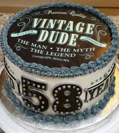 a 50th birthday cake is decorated with the number fifty and has an old - fashioned logo