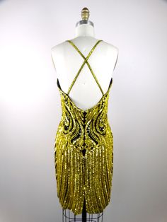 "This is an EXQUISITE vintage mini dress from Lillie Rubin. It's beautifully detailed with glass beading, sequins and jewels and in excellent condition! Bust - 34\" Waist - 26\" Hips - 36\" Length - 38\" Tag Size - Small This dress comes from a pet-free and smoke-free home. If you would like more info or have any questions, please don't hesitate to ask!" Gatsby Style Fitted Sequin Cocktail Dress, Fitted Gatsby Sequin Cocktail Dress, Fitted Gatsby Style Sequin Cocktail Dress, Gatsby Style Sequin Dress For Evening Party, Gatsby Style Sequin Dress For Evening, Glamorous Fitted Sequin Dress With Beaded Fringe, Fitted Gatsby Style Sequin Evening Dress, Fitted Embellished Gatsby Sequin Dress, Evening Sequin Mini Dress With Beaded Straps